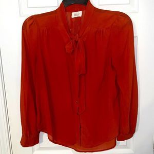 Burnt orange pussy bow tie shirt